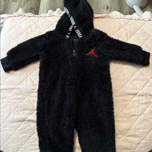 Black Fuzzy Hooded Baby Onesie with Red Logo